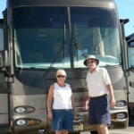 Couple Standing in front of Bus